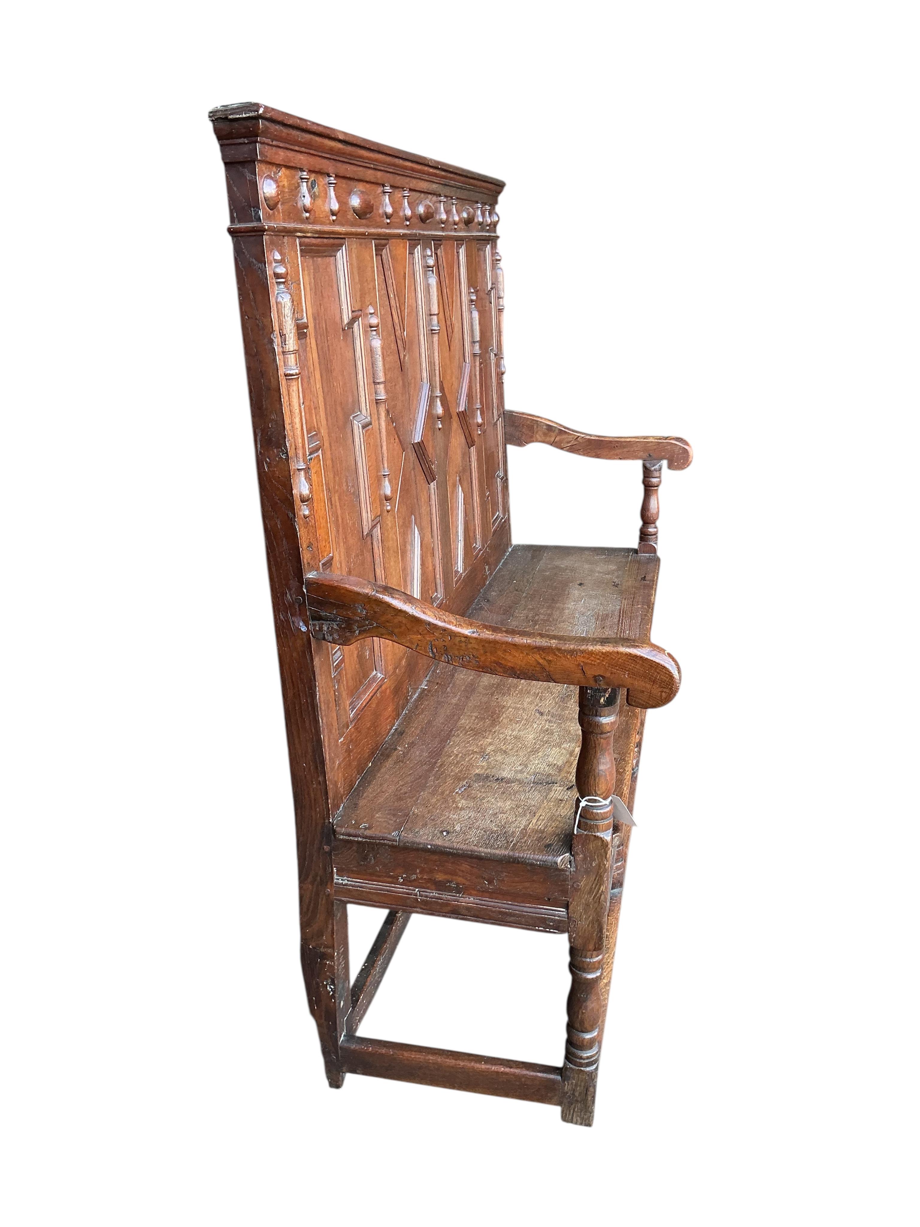 A Victorian panelled oak settle, width 173cm, depth 46cm, height 126cm